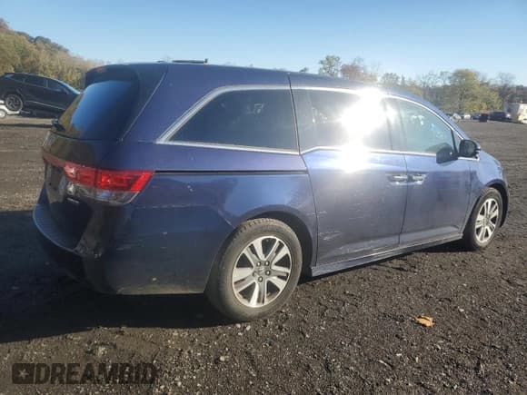 ✅ 2014 Honda Odyssey Touring • VIN: 5FNRL5H95EB025631 • Lot: 87088345. Listed on Copart with 144,539 mi. Free auction sales archive from the USA and detailed vehicle history report at DreamBid. Image 3.