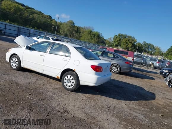 ✅ 2004 Toyota Corolla CE • VIN: 1NXBR32EX4Z326293 • Lot: 43435659. Listed on IAAI with 299,999 mi. Free auction sales archive from the USA and detailed vehicle history report at DreamBid. Image 3.