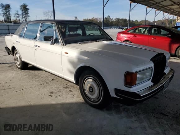 ✅ 1987 Rolls-Royce Silver Spur • VIN: SCAZN02A7HCX21836 • Лот: 82896744. Опубликован ранее на Copart с пробегом 102 544 миль. Бесплатный доступ к архиву аукционных продаж из США и подробный отчёт об истории автомобиля на DreamBid. Изображение 4.