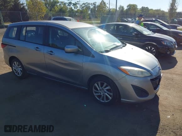 ✅ 2012 Mazda 5 Sport • VIN: JM1CW2BL3C0140935 • Lot: 43357001. Listed on IAAI with 105,389 mi. Free auction sales archive from the USA and detailed vehicle history report at DreamBid. Image 1.