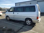 ✅ 2003 Volkswagen EuroVan MV • VIN: WV2MB47003H042703 • Лот: 87093944. Опубликован ранее на Copart с пробегом 127 872 миль. Бесплатный доступ к архиву аукционных продаж из США и подробный отчёт об истории автомобиля на DreamBid. Изображение 2.