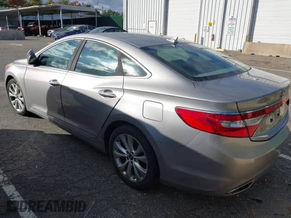 2013 Hyundai Azera with VIN KMHFG4JG3DA329523, listed as a IAAI auction lot 43593562 with 93,702 mi miles and . Bid and sale history available at DreamBid. Image 3.