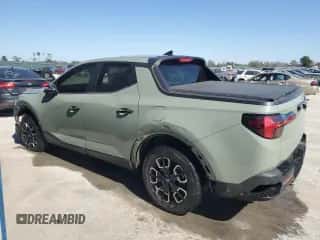 2022 Hyundai Santa Cruz SEL z VIN 5NTJB4AE1NH007406, wystawiony jako Copart lot #75457224 z przebiegiem 23 725 mil mil oraz Szkoda całkowita • Salvage title. Historia ofert i sprzedaży dostępna na DreamBid. Obrazek 2.