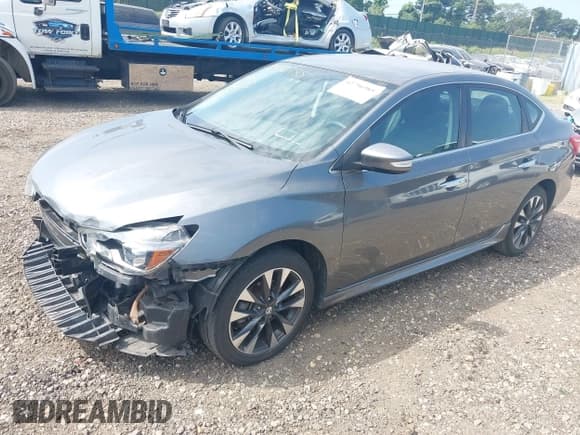 ✅ 2018 Nissan Sentra S • VIN: 3N1AB7AP0JY205055 • Lot: 42796985. Listed on IAAI with 15,456 mi. Free auction sales archive from the USA and detailed vehicle history report at DreamBid. Image 2.