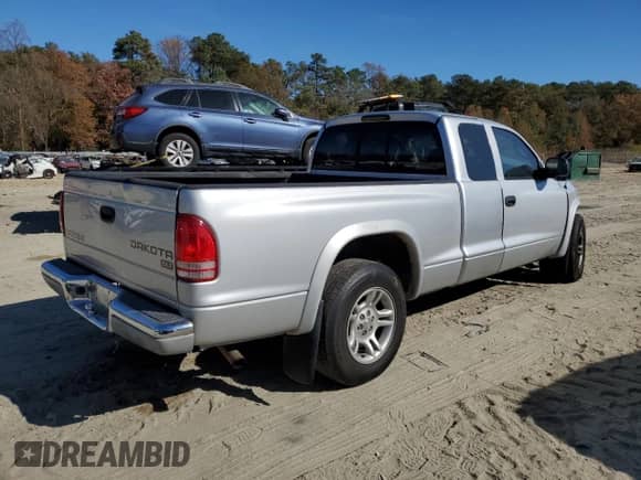 2003 Dodge Dakota SLT with VIN 1D7HL42N53S266476, listed as a Copart auction lot 79446004 with 139,911 mi miles and Salvage title. Bid and sale history available at DreamBid. Image 3.