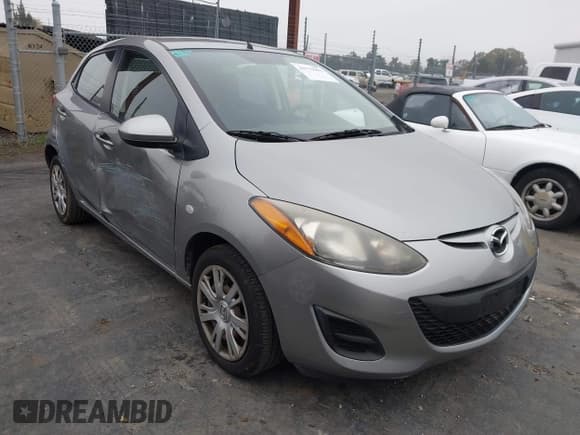 ✅ 2012 Mazda 2 Sport • VIN: JM1DE1KZ2C0145209 • Lot: 43779983. Listed on IAAI with 74,127 mi. Free auction sales archive from the USA and detailed vehicle history report at DreamBid. Image 1.