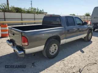 2001 Dodge Dakota Sport z VIN 1B7HL2AN61S301927, wystawiony jako Copart lot #74676094 z przebiegiem 228 616 mil mil oraz Szkoda całkowita • Salvage title. Historia ofert i sprzedaży dostępna na DreamBid. Obrazek 3.