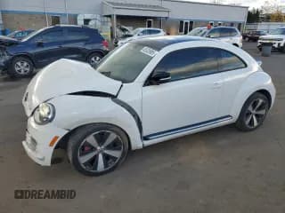 ✅ 2012 Volkswagen Beetle Turbo • VIN: 3VWVA7ATXCM660582 • Lot: 85328985. Listed on Copart with 95,004 mi. Free auction sales archive from the USA and detailed vehicle history report at DreamBid. Image 1.