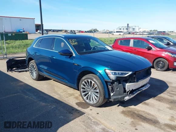 ✅ 2019 Audi e-tron Prestige • VIN: WA1VABGE0KB009718 • Lot: 42336983. Listed on IAAI with 54,871 mi. Free auction sales archive from the USA and detailed vehicle history report at DreamBid. Image 1.