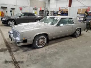 ✅ 1984 Cadillac Eldorado • VIN: 1G6AL5785EE630873 • Lot: 82896404. Listed on Copart with 3,839 mi. Free auction sales archive from the USA and detailed vehicle history report at DreamBid. Image 1.