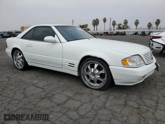 ✅ 1999 Mercedes-Benz SL 500 • VIN: WDBFA68F7XF180540 • Lot: 82333045. Listed on Copart with 133,557 mi. Free auction sales archive from the USA and detailed vehicle history report at DreamBid. Image 4.