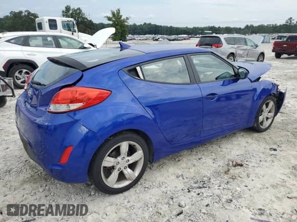 2012 Hyundai Veloster w/Gray Int с VIN KMHTC6AD8CU037430, выставлен на аукционе Copart как лот 69676955 с пробегом 115 290 миль миль и Списание • Salvage title. История ставок и продаж доступна на DreamBid. Изображение 3.