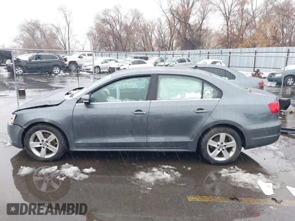 ✅ 2014 Volkswagen Jetta TDI w/Premium/Nav • VIN: 3VWLL7AJ4EM332920 • Lot: 41630948. Listed on IAAI with 148,754 mi. Free auction sales archive from the USA and detailed vehicle history report at DreamBid. Image 14.