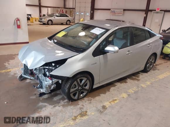 2021 Toyota Prius L Eco with VIN JTDKAMFU4M3147210, listed as a IAAI auction lot 42437023 with 12,673 mi miles and . Bid and sale history available at DreamBid. Image 17.