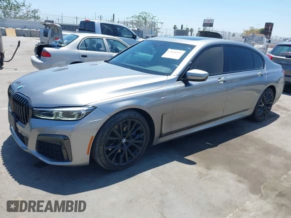 ✅ 2022 BMW 7 Series 740i • VIN: WBA7T2C05NCH09817 • Лот: 42648559. Опубликован ранее на IAAI с пробегом 34 261 миль. Бесплатный доступ к архиву аукционных продаж из США и подробный отчёт об истории автомобиля на DreamBid. Изображение 2.