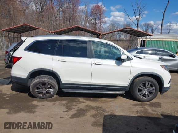 ✅ 2017 Honda Pilot EX-L • VIN: 5FNYF6H71HB061036 • Lot: 41891446. Listed on IAAI with 194,566 mi. Free auction sales archive from the USA and detailed vehicle history report at DreamBid. Image 13.