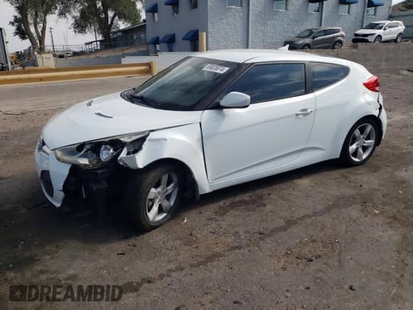 2013 Hyundai Veloster w/Gray Int z VIN KMHTC6AD7DU166325, wystawiony jako Copart lot #69826874 z przebiegiem 176 572 mil mil oraz Szkoda całkowita • Salvage title. Historia ofert i sprzedaży dostępna na DreamBid. Obrazek 1.