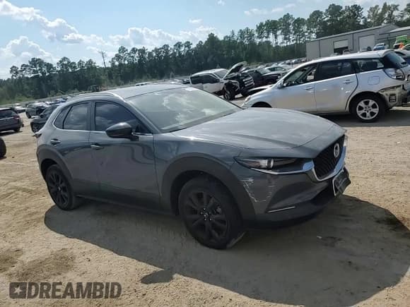 ✅ 2022 Mazda CX-30 S Carbon Edition • VIN: 3MVDMBCL8NM414346 • Лот: 71610055. Опубликован ранее на Copart с пробегом Не указан. Бесплатный доступ к архиву аукционных продаж из США и подробный отчёт об истории автомобиля на DreamBid. Изображение 14.