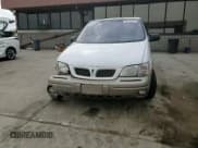 ✅ 1999 Pontiac Montana • VIN: 1GMDX03E2XD344304 • Лот: 61469595. Опубликован ранее на Copart с пробегом 240 697 миль. Бесплатный доступ к архиву аукционных продаж из США и подробный отчёт об истории автомобиля на DreamBid. Изображение 14.