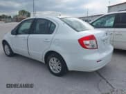 ✅ 2013 Suzuki SX4 LE • VIN: JS2YC5A31D6101654 • Lot: 42970256. Wystawiony na IAAI z przebiegiem 142 596 mil. Bezpłatny archiwum sprzedaży aukcyjnych z USA i szczegółowy raport historii pojazdu na DreamBid. Zdjęcie 3.