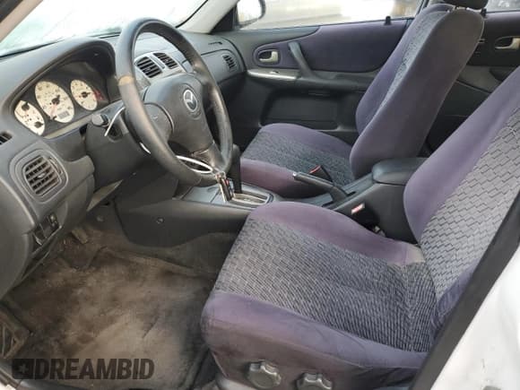 ✅ 2002 Mazda Protege • VIN: JM1BJ245121567998 • Lot: 92867455. Listed on Copart with 134,851 mi. Free auction sales archive from the USA and detailed vehicle history report at DreamBid. Image 7.