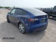 ✅ 2023 Tesla Model Y Long Range • VIN: 7SAYGDEE5PA076268 • Lot: 43140234. Wystawiony na IAAI z przebiegiem 26 918 mil. Bezpłatny archiwum sprzedaży aukcyjnych z USA i szczegółowy raport historii pojazdu na DreamBid. Zdjęcie 3.