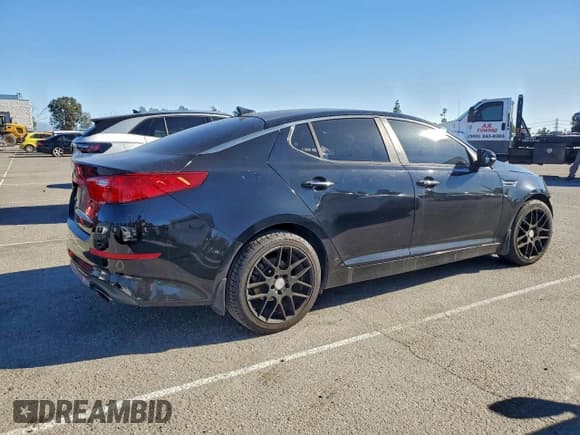 ✅ 2014 Kia Optima LX • VIN: 5XXGM4A75EG329580 • Lot: 95564365. Listed on Copart with 128,899 mi. Free auction sales archive from the USA and detailed vehicle history report at DreamBid. Image 3.