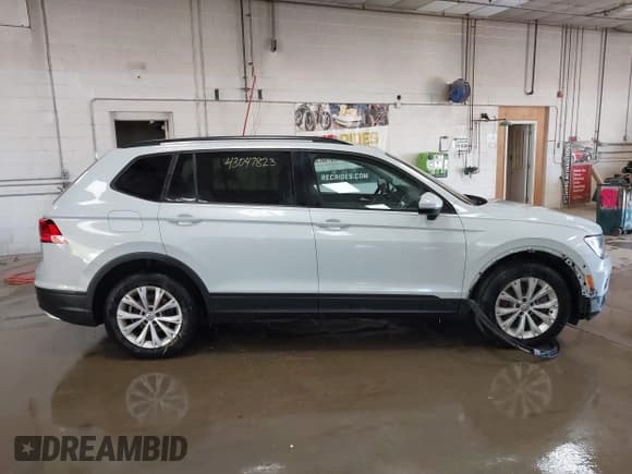 ✅ 2018 Volkswagen Tiguan S • VIN: 3VV0B7AX5JM108371 • Lot: 43047823. Listed on IAAI with 80,531 mi. Free auction sales archive from the USA and detailed vehicle history report at DreamBid. Image 13.