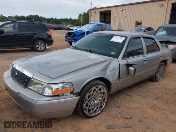 ✅ 2005 Mercury Grand Marquis LS Premium • VIN: 2MEFM75W55X650289 • Lot: 43072952. Listed on IAAI with 243,608 mi. Free auction sales archive from the USA and detailed vehicle history report at DreamBid. Image 2.