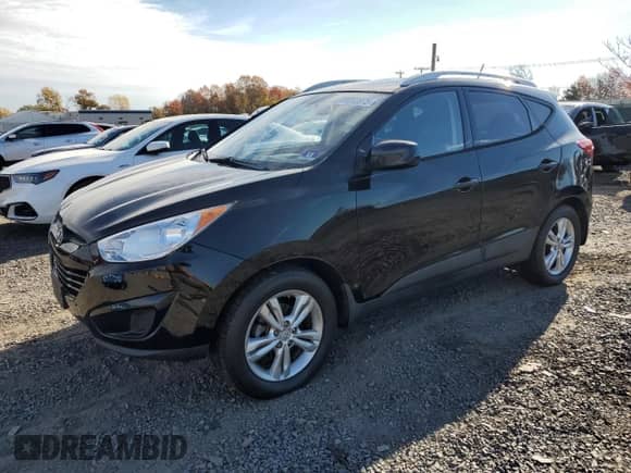 2011 Hyundai Tucson GLS z VIN KM8JU3AC5BU243989, wystawiony jako Copart lot #91693925 z przebiegiem 151 662 mil mil oraz Czysty tytuł • Clean title. Historia ofert i sprzedaży dostępna na DreamBid. Obrazek 1.