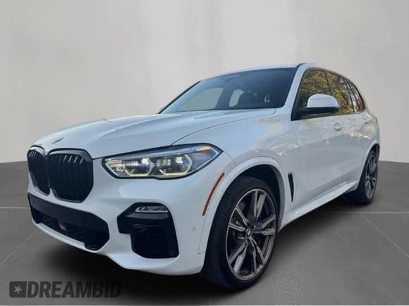 ✅ 2020 BMW X5 M50i • VIN: 5UXJU4C0XLLE45698 • Лот: 86595285. Опубликован ранее на Copart с пробегом 105 475 миль. Бесплатный доступ к архиву аукционных продаж из США и подробный отчёт об истории автомобиля на DreamBid. Изображение 2.