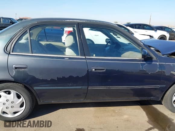 ✅ 1999 Toyota Corolla CE • VIN: 1NXBR12EXXZ252527 • Lot: 43668301. Listed on IAAI with 134,473 mi. Free auction sales archive from the USA and detailed vehicle history report at DreamBid. Image 14.