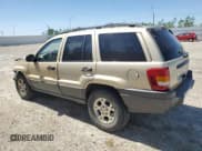 ✅ 2001 Jeep Grand Cherokee Laredo • VIN: 1J4GW48S11C567869 • Lot: 58847415. Listed on Copart with 217,279 mi. Free auction sales archive from the USA and detailed vehicle history report at DreamBid. Image 2.