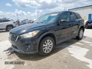 ✅ 2016 Mazda CX-5 Touring • VIN: JM3KE4CY2G0614407 • Lot: 68296175. Listed on Copart with 150,420 mi. Free auction sales archive from the USA and detailed vehicle history report at DreamBid. Image 1.