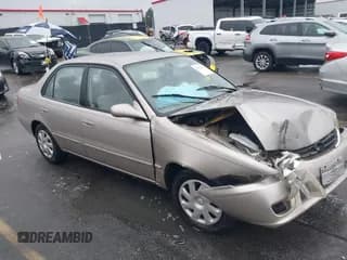 ✅ 2002 Toyota Corolla CE • VIN: 1NXBR12E82Z615593 • Lot: 43552424. Listed on IAAI with 228,478 mi. Free auction sales archive from the USA and detailed vehicle history report at DreamBid. Image 1.