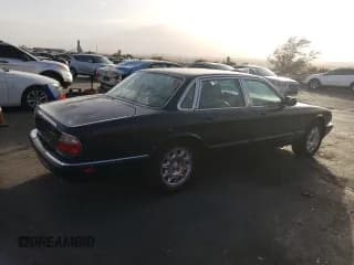 ✅ 1999 Jaguar XJ • VIN: SAJHD1048XC867723 • Лот: 76745444. Опубликован ранее на Copart с пробегом 170 999 миль. Бесплатный доступ к архиву аукционных продаж из США и подробный отчёт об истории автомобиля на DreamBid. Изображение 3.