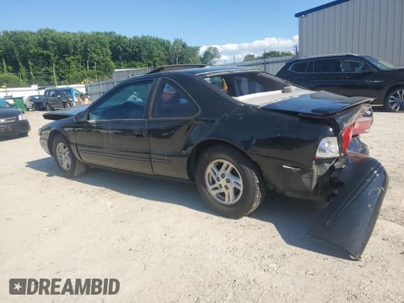 ✅ 1997 Ford Thunderbird LX • VIN: 1FALP62W2VH115047 • Lot: 61364635. Listed on Copart with 57,909 mi. Free auction sales archive from the USA and detailed vehicle history report at DreamBid. Image 2.