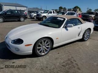 ✅ 2006 Jaguar XK XK8 • VIN: SAJDA42C662A46284 • Лот: 73175554. Опубликован ранее на Copart с пробегом 99 679 миль. Бесплатный доступ к архиву аукционных продаж из США и подробный отчёт об истории автомобиля на DreamBid. Изображение 1.