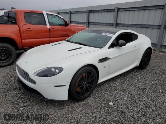 ✅ 2013 Aston Martin Vantage • VIN: SCFEKBAK4DGC17340 • Lot: 85629734. Listed on Copart with 34,975 mi. Free auction sales archive from the USA and detailed vehicle history report at DreamBid. Image 1.