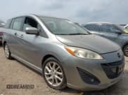 ✅ 2012 Mazda 5 Grand Touring • VIN: JM1CW2DL1C0126545 • Lot: 42301130. Listed on IAAI with 151,212 mi. Free auction sales archive from the USA and detailed vehicle history report at DreamBid. Image 1.