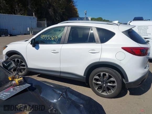 ✅ 2016 Mazda CX-5 Grand Touring • VIN: JM3KE4DY8G0908425 • Lot: 43350691. Wystawiony na IAAI z przebiegiem 144 684 mil. Bezpłatny archiwum sprzedaży aukcyjnych z USA i szczegółowy raport historii pojazdu na DreamBid. Zdjęcie 14.