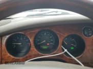 ✅ 2002 Jaguar XK • VIN: SAJDA42C52NA28075 • Lot: 58368965. Listed on Copart with 100,387 mi. Free auction sales archive from the USA and detailed vehicle history report at DreamBid. Image 9.