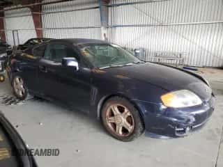 ✅ 2004 Hyundai Tiburon GS • VIN: KMHHM65D04U107131 • Лот: 72101305. Опубликован ранее на Copart с пробегом 136 073 миль. Бесплатный доступ к архиву аукционных продаж из США и подробный отчёт об истории автомобиля на DreamBid. Изображение 4.