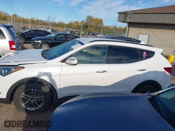 2018 Hyundai Santa Fe 2.4L z VIN 5NMZUDLB1JH097002, wystawiony jako IAAI lot #43473652 z przebiegiem 182 069 mil mil oraz . Historia ofert i sprzedaży dostępna na DreamBid. Obrazek 15.