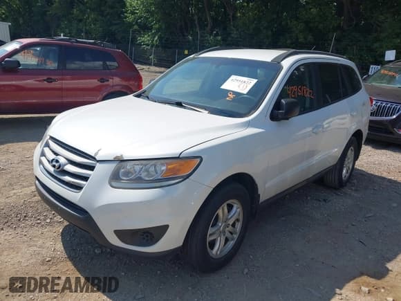 ✅ 2012 Hyundai Santa Fe GLS • VIN: 5XYZGDAG6CG117330 • Lot: 42951822. Listed on IAAI with 124,187 mi. Free auction sales archive from the USA and detailed vehicle history report at DreamBid. Image 2.