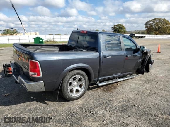 ✅ 2014 Ram 1500 Laramie • VIN: 1C6RR7NT7ES162879 • Лот: 89878515. Опубликован ранее на Copart с пробегом 121 717 миль. Бесплатный доступ к архиву аукционных продаж из США и подробный отчёт об истории автомобиля на DreamBid. Изображение 3.
