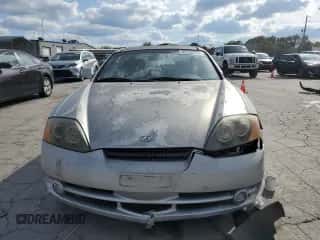 ✅ 2003 Hyundai Tiburon GT • VIN: KMHHN65F03U055237 • Лот: 82400615. Опубликован ранее на Copart с пробегом 244 468 миль. Бесплатный доступ к архиву аукционных продаж из США и подробный отчёт об истории автомобиля на DreamBid. Изображение 5.