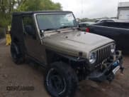 ✅ 2005 Jeep Wrangler Unlimited • VIN: 1J4FA44S15P301007 • Lot: 43384865. Listed on IAAI with 133,877 mi. Free auction sales archive from the USA and detailed vehicle history report at DreamBid. Image 1.