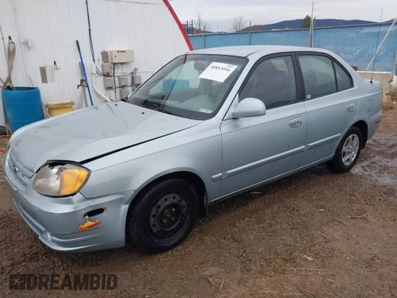 2003 Hyundai Accent GL z VIN KMHCG45C43U465523, wystawiony jako IAAI lot #40883056 z przebiegiem 95 770 mil mil oraz . Historia ofert i sprzedaży dostępna na DreamBid. Obrazek 2.