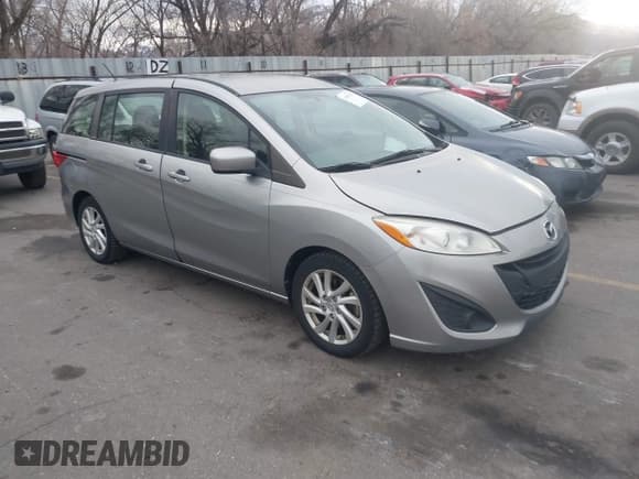 ✅ 2012 Mazda 5 Sport • VIN: JM1CW2BL8C0101127 • Lot: 43899580. Wystawiony na IAAI z przebiegiem 176 755 mil. Bezpłatny archiwum sprzedaży aukcyjnych z USA i szczegółowy raport historii pojazdu na DreamBid. Zdjęcie 1.